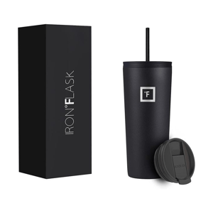A black Iron Flask tumbler with a matching straw and an interchangeable lid is shown next to its packaging box.