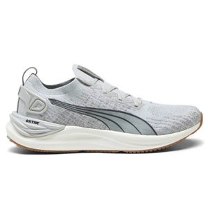 A gray Puma athletic sneaker featuring a knitted upper, prominent side branding, cushioning sole, and rubber outsole for traction.