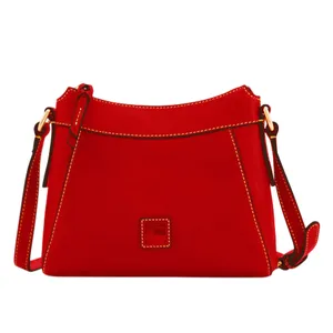 A red leather crossbody bag featuring gold hardware, contrast stitching, and an adjustable strap.