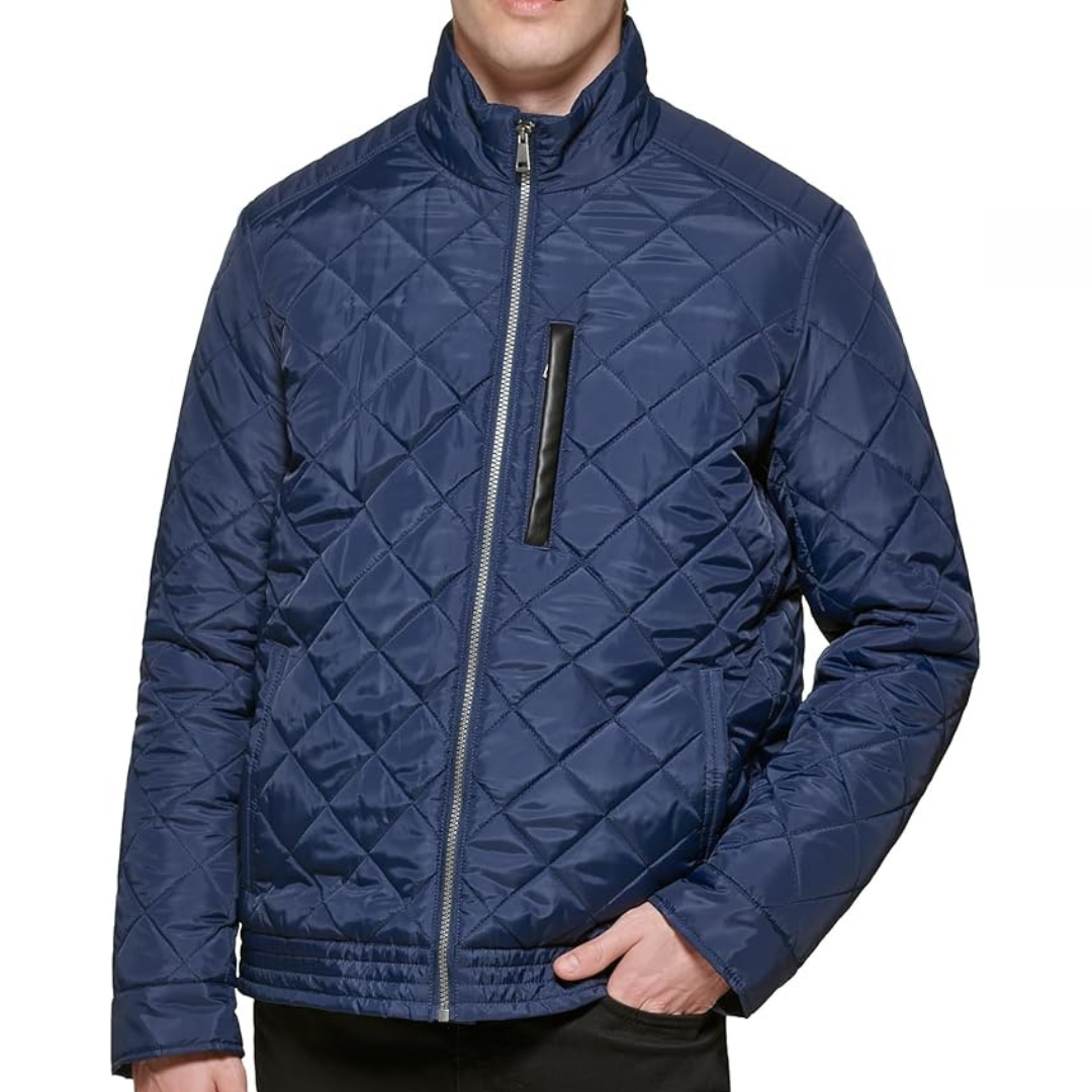 A navy blue quilted jacket with a front zip closure and a stand-up collar, featuring a sleek chest zip pocket and side pockets.