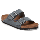 A gray sandal featuring two adjustable straps with metal buckles, a cork footbed, and a textured rubber sole.