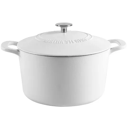 A white cast iron Dutch oven with a lid, featuring a knob handle and embossed text on the top.