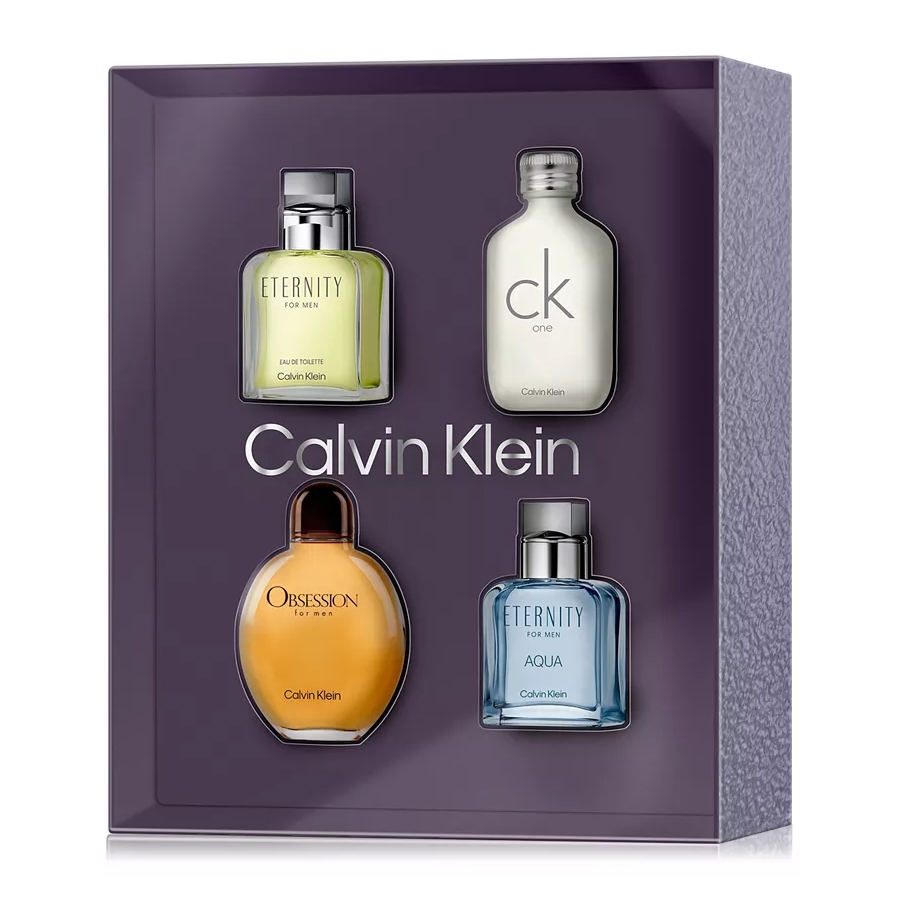 The Calvin Klein Fragrance Gift Set includes four mini eau de toilettes: Eternity for Men, CK One, Obsession for Men, and Eternity Aqua for Men, all presented in a purple box.