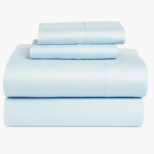 A set of light blue bed sheets neatly folded, including a flat sheet, fitted sheet, and two pillowcases.