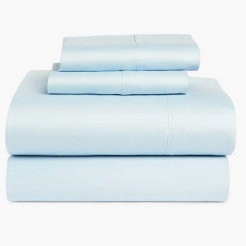 A set of light blue bed sheets neatly folded, including a flat sheet, fitted sheet, and two pillowcases.