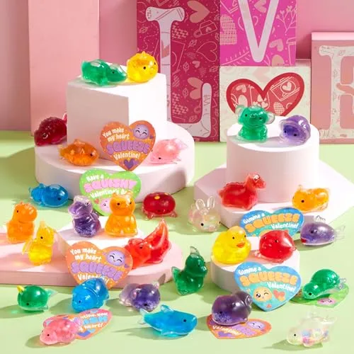 Colorful gel-like animal toys displayed on white tiered stands, with heart-shaped Valentine's messages like \“You make my heart SQUEEZE\“ in a vibrant setting.