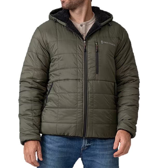 The Free Country Reversible Puffer Jacket is an olive-green, quilted, hooded jacket with a zippered front and side pockets, featuring a chest pocket and sherpa lining for added warmth.