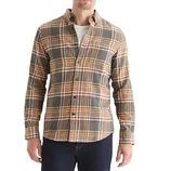 A man wears a plaid button-up flannel shirt in shades of gray, yellow, and orange, layered over a white T-shirt, paired with dark jeans.