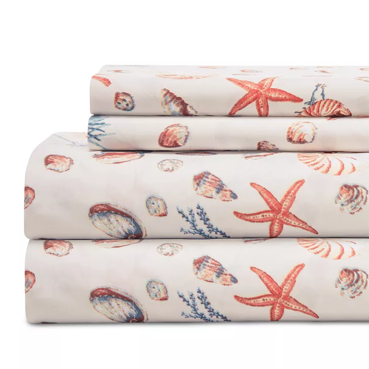 Queen Coastal Printed Sheet Sets feature a nautical theme with designs of seashells, starfish, and coral in soft hues, providing a beach-inspired look.