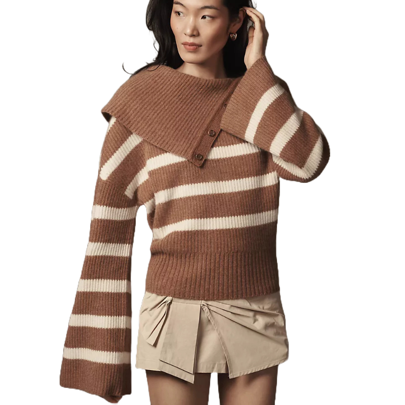 Brown and cream striped cashmere sweater featuring bell sleeves and an asymmetrical buttoned collar. Paired with a beige pleated mini skirt.