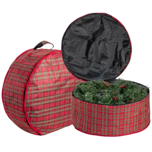 Two round plaid storage bags, one open and one closed, designed for storing artificial wreaths or similar decorations.