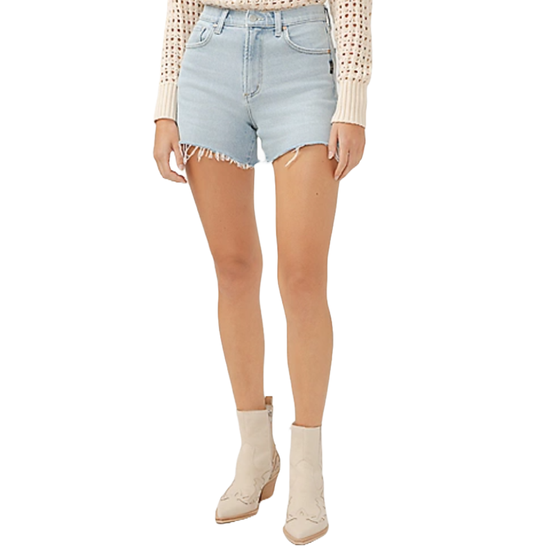 Light denim frayed hem shorts paired with a cream knit sweater and white ankle boots.