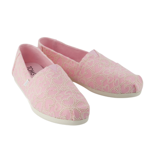Pink slip-on shoes with a heart design pattern, featuring a white sole and inner lining.