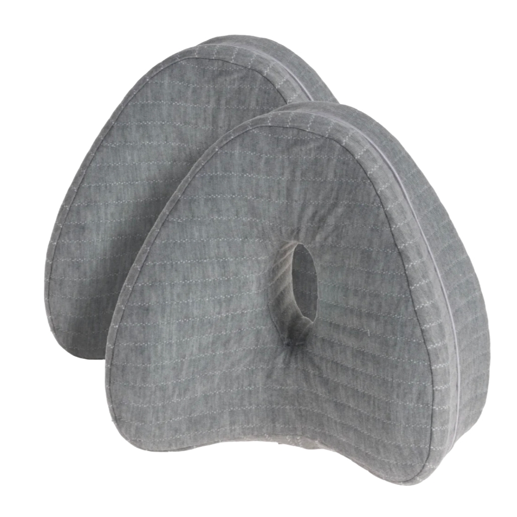 Two gray, contoured knee pillows designed to fit between the knees for support and cooling during sleep. The pillows boast a quilted texture.
