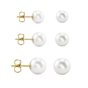 A set of three pairs of white pearl stud earrings with gold posts and butterfly backs, varying in pearl size.