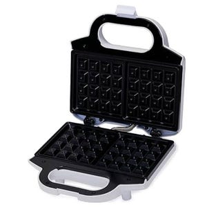 A waffle maker with a black non-stick grid, featuring two square sections and a white handle, designed for making waffles at home.