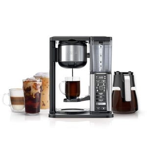 This is a Ninja Coffee Maker with a glass carafe, a built-in frother, and various cups of coffee, including iced and latte options. The machine features a digital control panel.