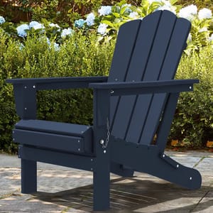 A navy blue Adirondack chair is shown in a garden setting, with green foliage and blooming hydrangeas in the background.