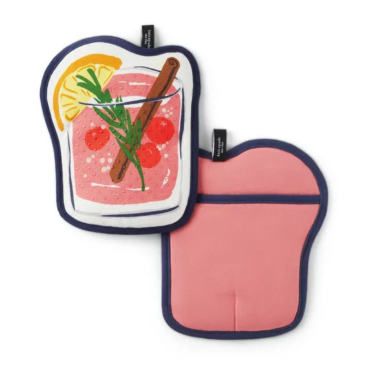Two pot holders: one with a graphic of a pink cocktail featuring lemon slices, rosemary, cherries, and a cinnamon stick, the other solid pink with a dark border.