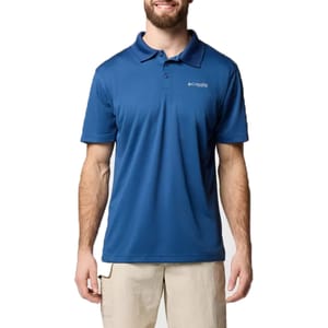 A man is wearing a blue Columbia polo shirt with short sleeves and beige shorts. The shirt features a small logo on the upper chest.