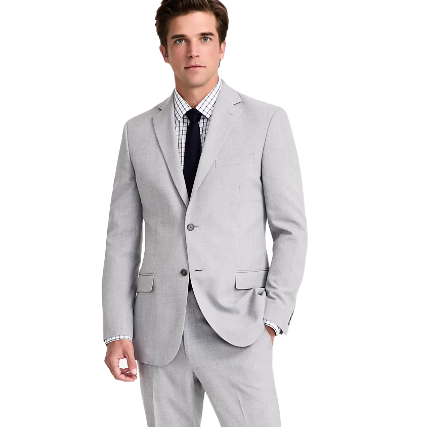 A man is wearing a light gray two-button suit with a notch lapel, paired with a white checkered dress shirt and a dark tie.