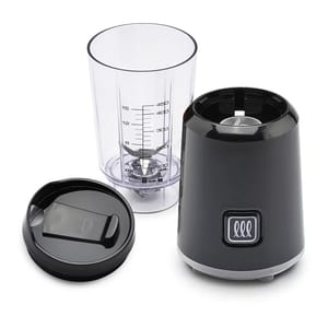 A compact blender with a transparent measuring cup, blade assembly, and a black motor base with control button. Includes a black lid designed for the cup.