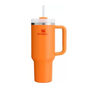 Bright orange 40oz Stanley tumbler with a sturdy handle, insulated body, and a lid featuring a built-in straw. Iconic \“STANLEY\“ logo displayed in red.