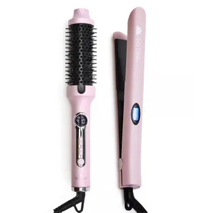 A pink hair styling set featuring a heated round brush and a flat iron, both with digital controls.