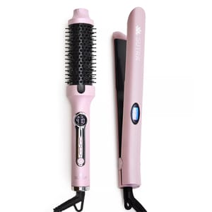 A pink hair styling set featuring a heated round brush and a flat iron, both with digital controls.
