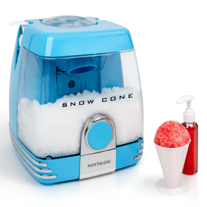 Blue snow cone machine with a white cone of shaved ice beside it and a bottle of red syrup.