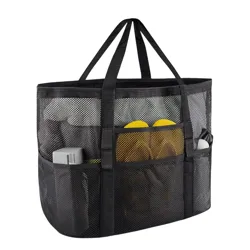 A black mesh tote bag with multiple pockets holds various items, including bottles and flip-flops.
