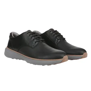 Pair of black lace-up shoes with textured uppers and gray soles, featuring a brown accent strip between the upper and sole.