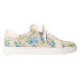 A sneaker adorned with a floral pattern of blue and yellow flowers on a beige background, featuring white laces and a white sole.