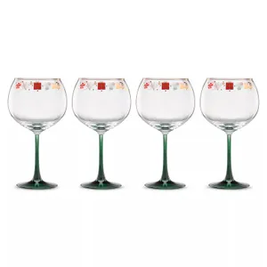 Set of four stemmed glasses with green bases and festive decorative rims featuring holiday-themed patterns.