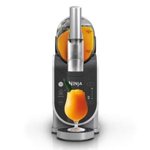 The Ninja SLUSHi Frozen Drink Maker is a sleek machine designed to create frozen drinks. It features a large orange slushie output, intuitive controls, and a compact design ideal for countertop use.