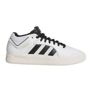White and black Adidas Tyshawn sneakers featuring black stripes and a textured sole.