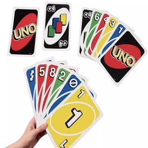 A hand holding a spread of colorful UNO playing cards, alongside separate cards showing the UNO logo and a draw four card.