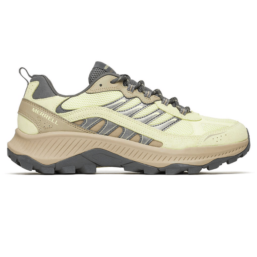 A Merrell hiking shoe featuring a beige and yellow color scheme, rugged outsole, and breathable mesh upper designed for outdoor activities.