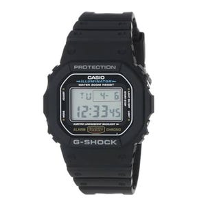 Casio G-Shock digital watch with black strap, illuminator backlight, water resistance, alarm, and stopwatch functions displayed.