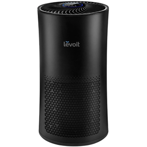 A black Levoit air purifier with a cylindrical design and a top control panel featuring a blue ring.