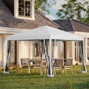 A white canopy tent with transparent curtains is set up in a backyard over a dining table and chairs, near a house with large windows and a tiled roof.