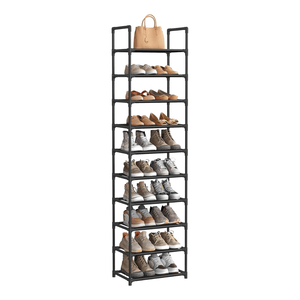 A tall black shoe rack with multiple tiers holds various shoes and a handbag on top, organized neatly for storage and display.
