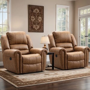 Two brown leather recliners with nailhead trim sit on a patterned rug in a living room, separated by a small side table with a lamp.