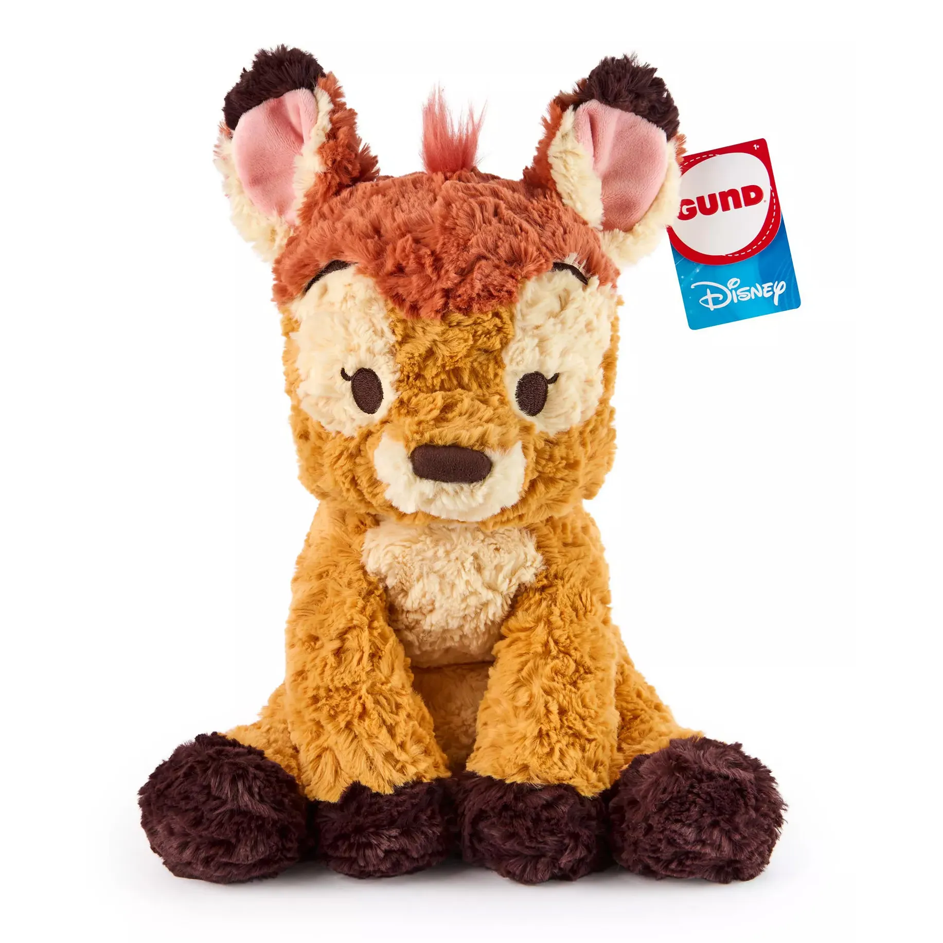 GUND Disney plush toy featuring a cute, fluffy character, possibly a fawn, with soft brown and cream fur, large ears, and a tuft of orange hair. It has a blue Disney tag attached.