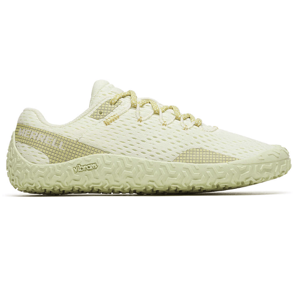 Lightweight athletic shoe with a textured, Vibram rubber sole and a mesh upper in a pale yellow color, featuring a minimalistic design.