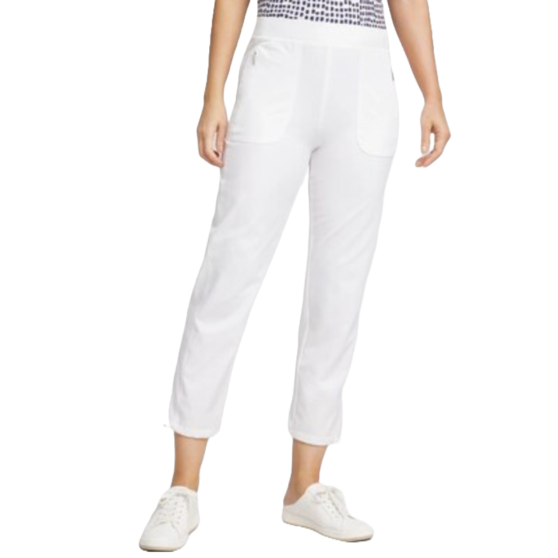 White ankle-length pants with front pockets paired with white sneakers and a patterned top.