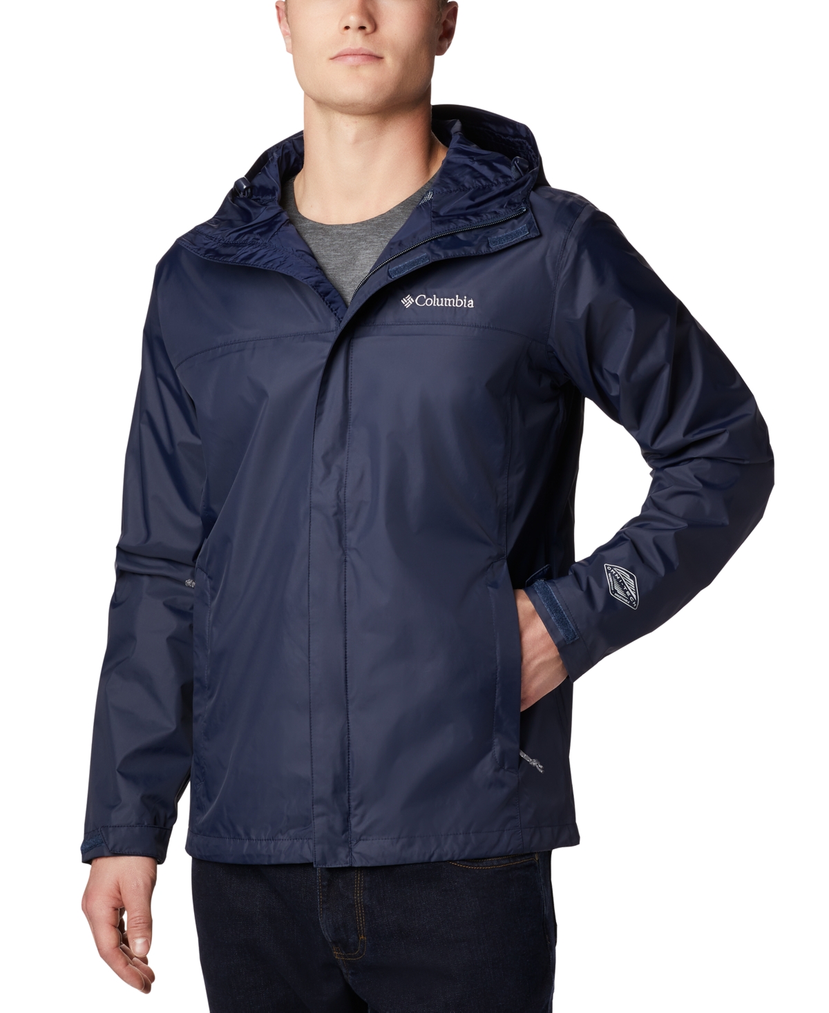 A navy blue Columbia Watertight II Jacket is shown, featuring a hood, Columbia logo on the chest, and a zippered front.