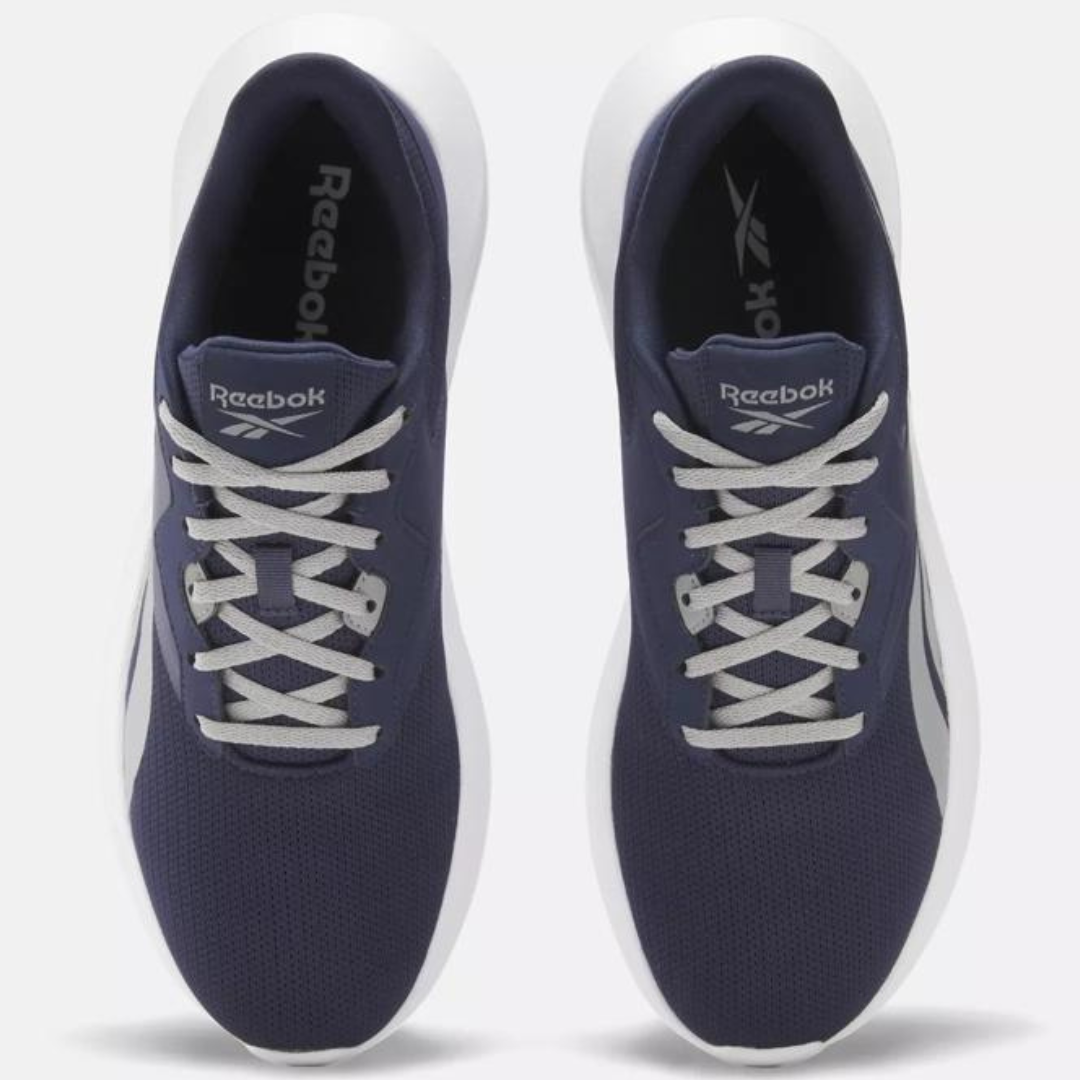 A pair of Reebok sneakers in navy blue with white soles and laces.