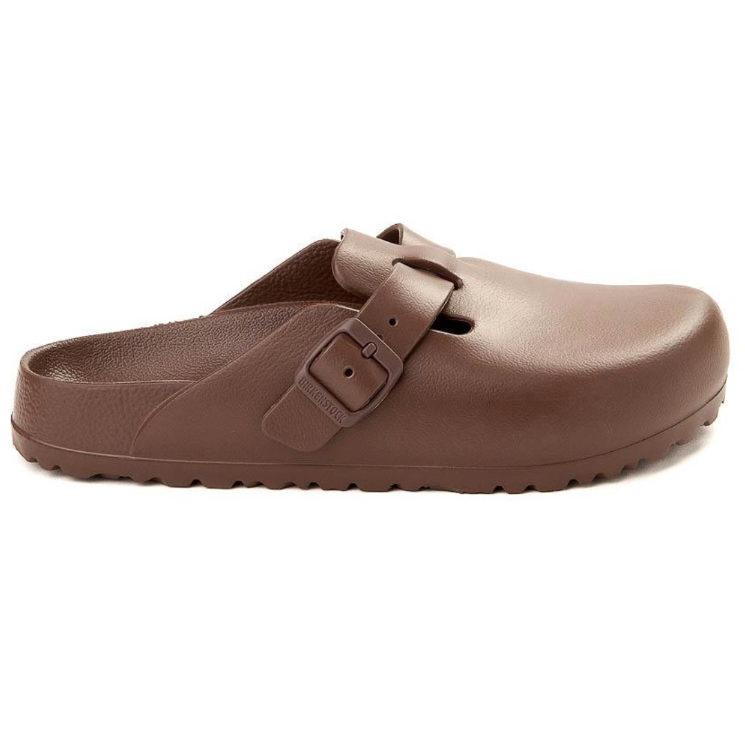A single brown clog-style shoe with a buckle strap.