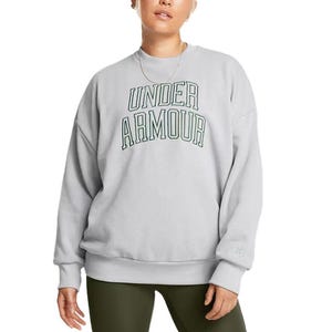A person is wearing a light grey Under Armour sweatshirt with a large brand logo on the front, paired with dark green leggings.